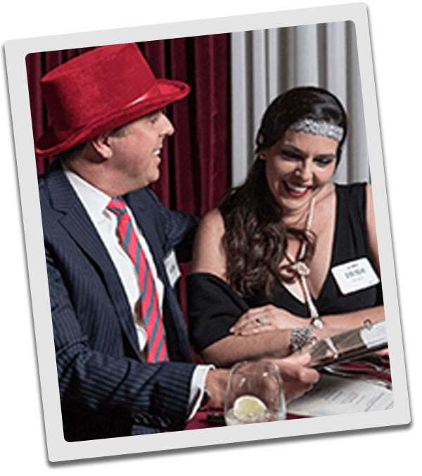Tampa Murder Mystery couple checking out the dinner menu